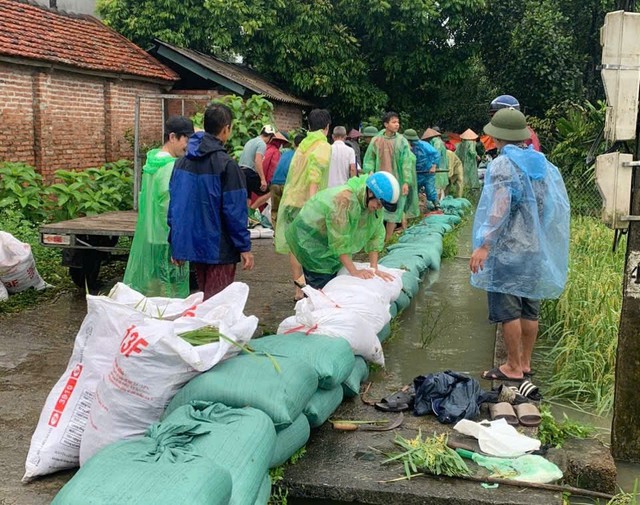 Mực nước sông Hồng lên báo động 2, Hà Nội có mưa to đến rất to- Ảnh 3.